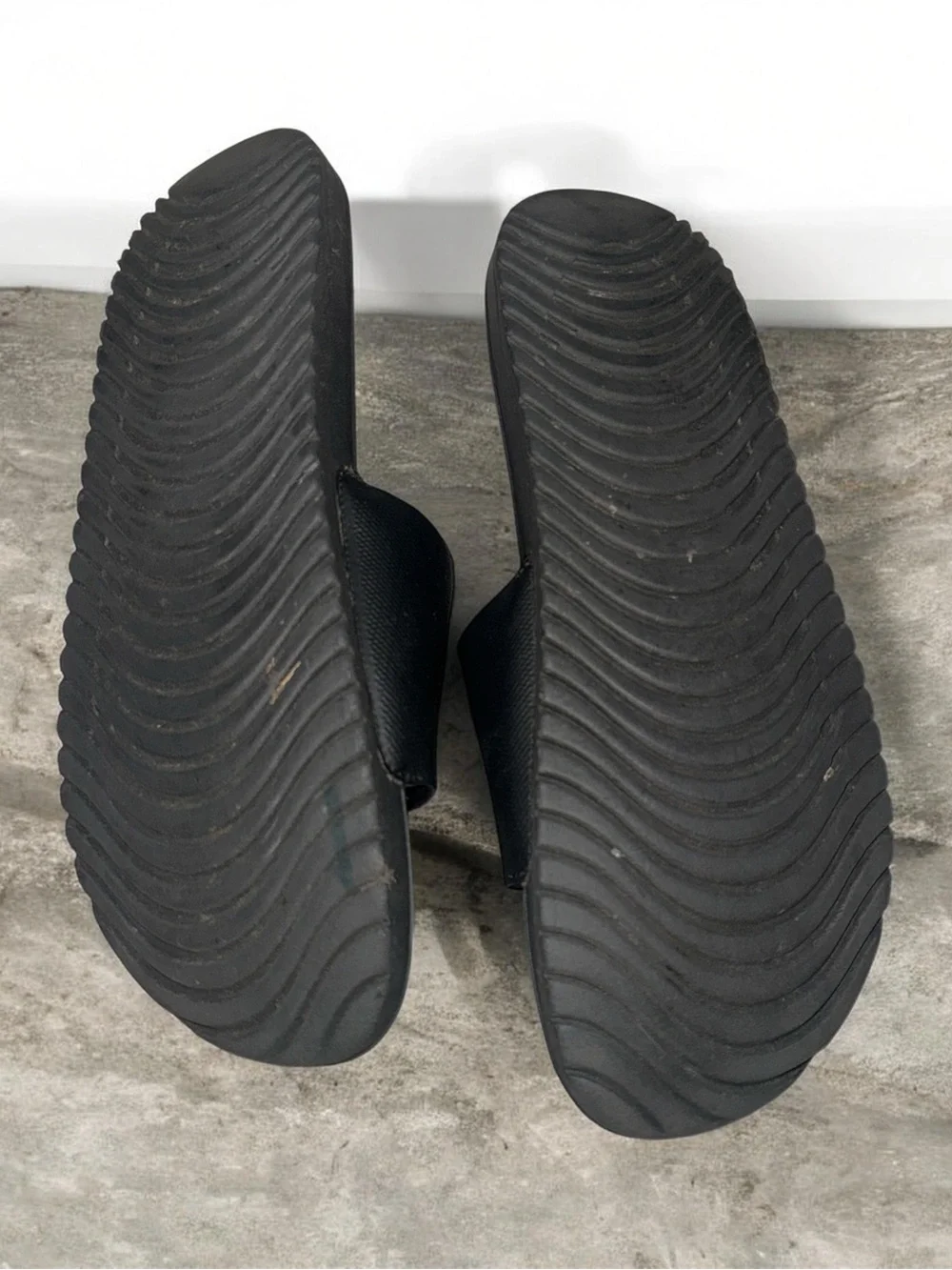 Nike Black Slides with White Swoosh Logo